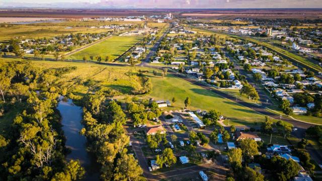 an aerial view of a park with a river and trees at Moree Tourist Park in Moree