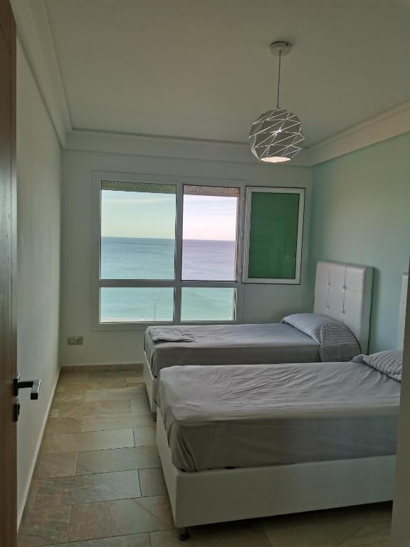 Letto o letti in una camera di AppartF3 vue panoramique sur mer Residence Vista Del Mar