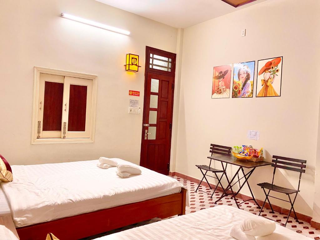 Postel nebo postele na pokoji v ubytování DK House Homestay