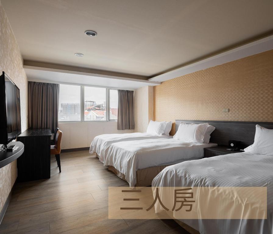 Postel nebo postele na pokoji v ubytování West Hotel