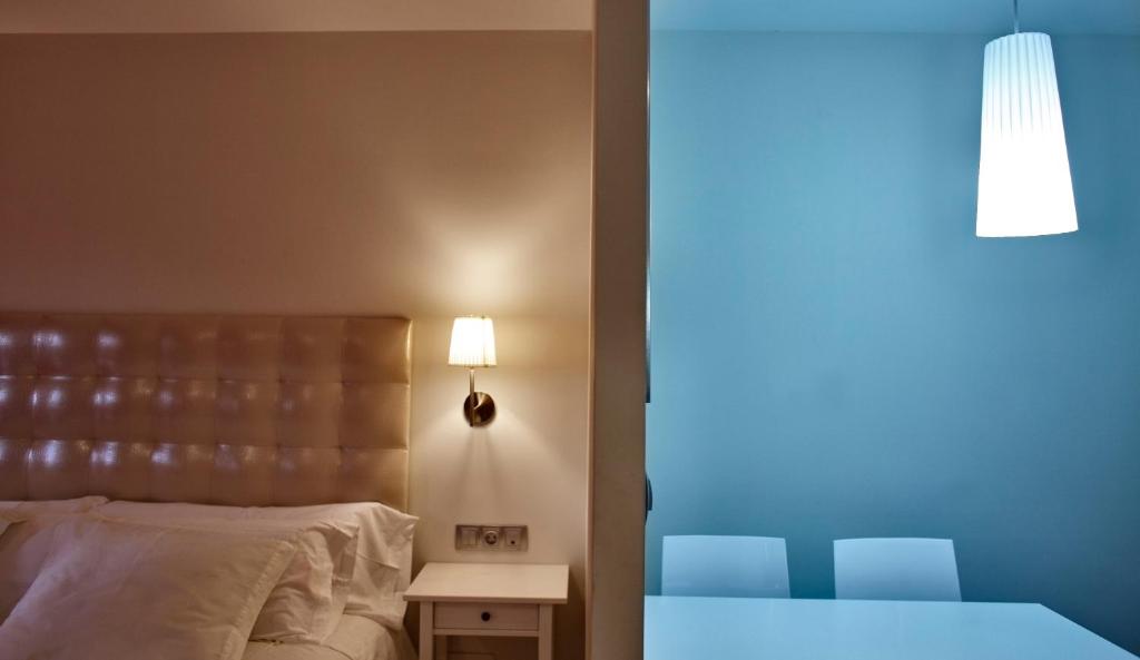 Postel nebo postele na pokoji v ubytování Apartamentos El Caserio