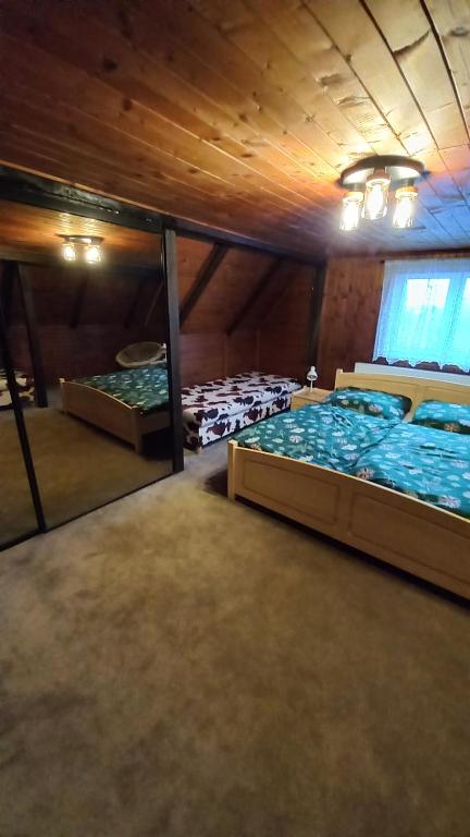 Postel nebo postele na pokoji v ubytování Chalupa na lužické stezce