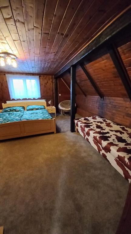 Postel nebo postele na pokoji v ubytování Chalupa na lužické stezce