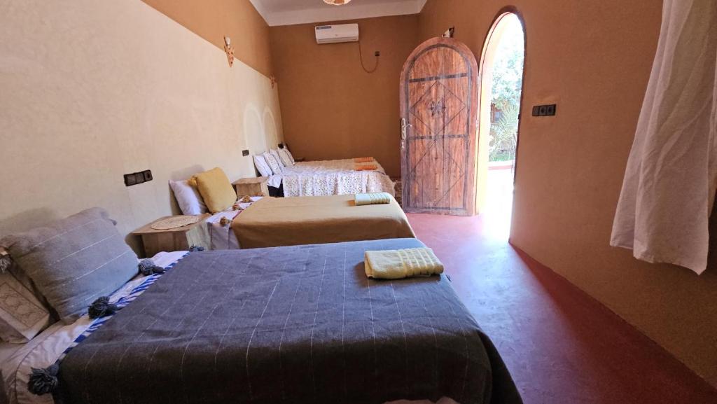 Letto o letti in una camera di Dar M'hamid