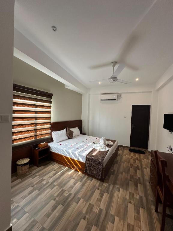 Кровать или кровати в номере Cocos Polhena