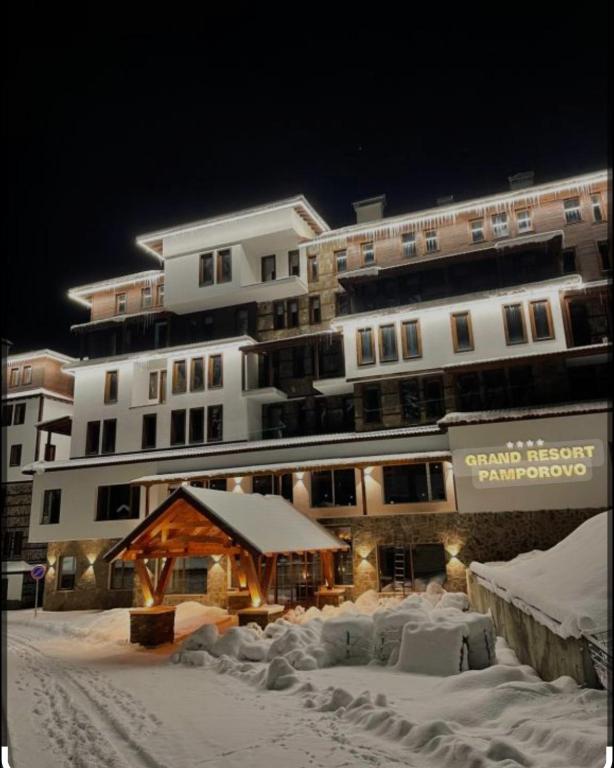 a large building with snow in front of it at La'Vista in Smolyan