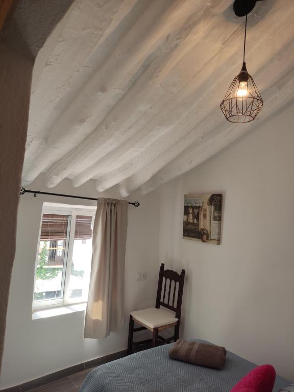 Postel nebo postele na pokoji v ubytování Casa Cueva