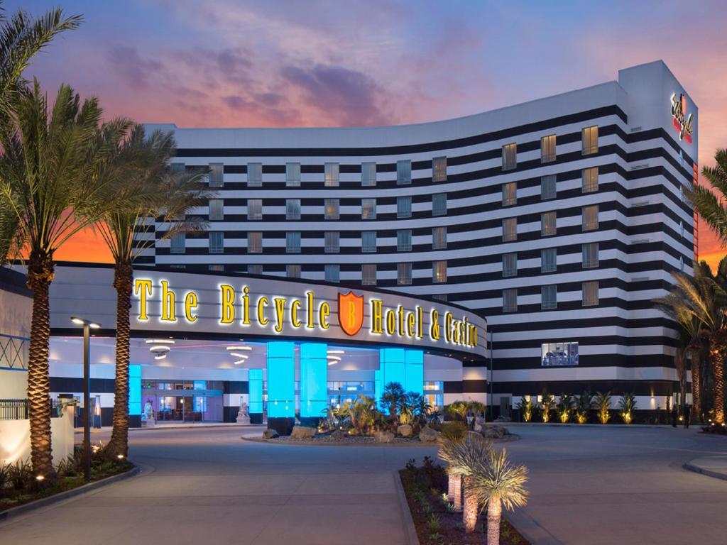 a hotel with a sign that reads the iceberg hotel and casino at Parkwest Bicycle Casino in Bell Gardens