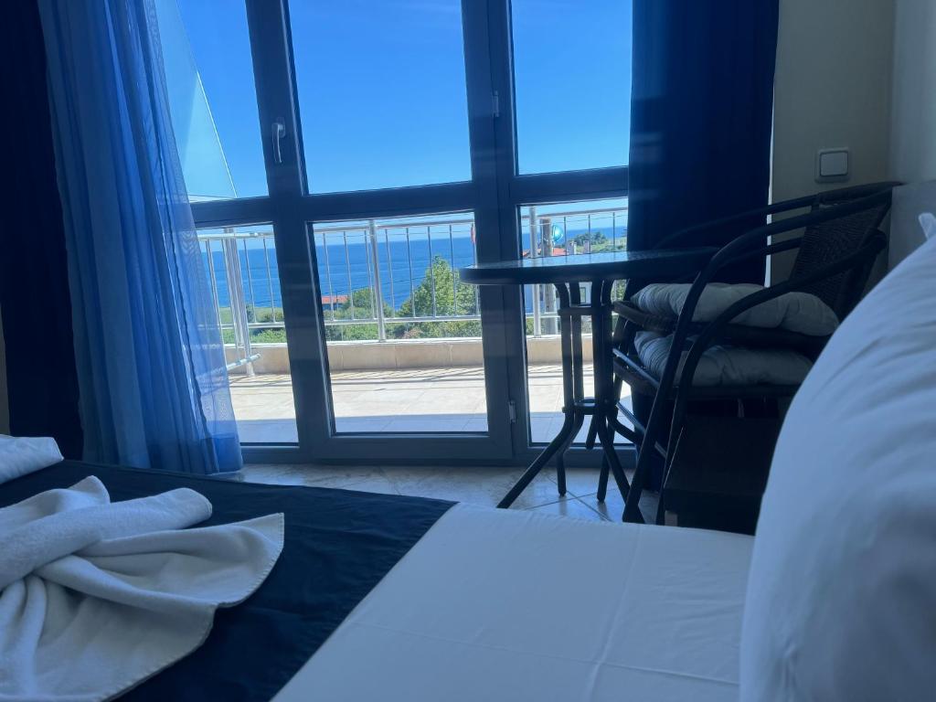 Postel nebo postele na pokoji v ubytování Afrodita Hotel