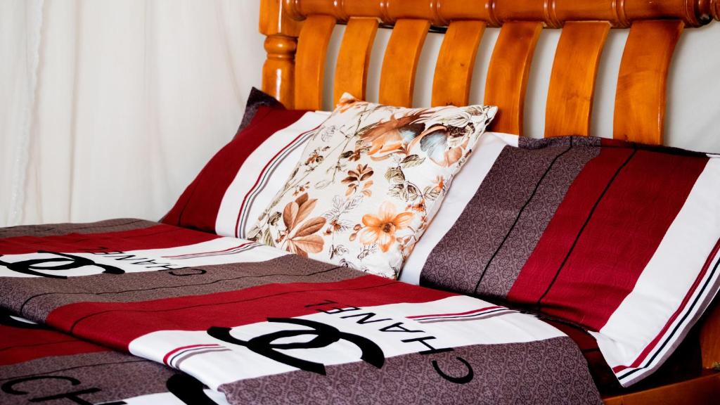 Postel nebo postele na pokoji v ubytování Hotel Deposh Tororo