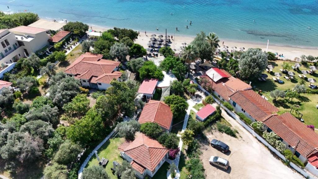 an aerial view of a resort near the beach at Physis Oikos Beachfront Apartments in Skiathos