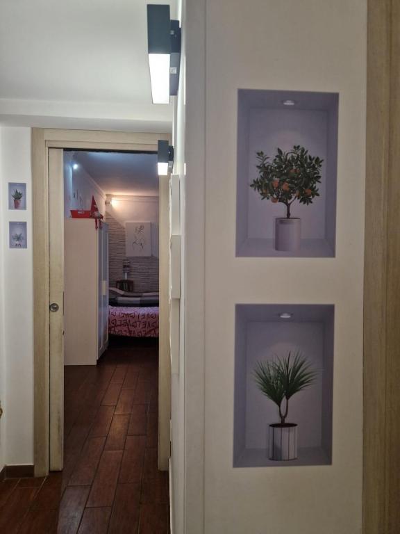 A bed or beds in a room at A casa di Delia - stazione Fidene