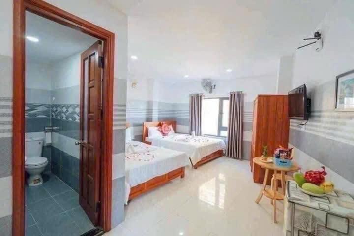 Postel nebo postele na pokoji v ubytování Luna House Hotel