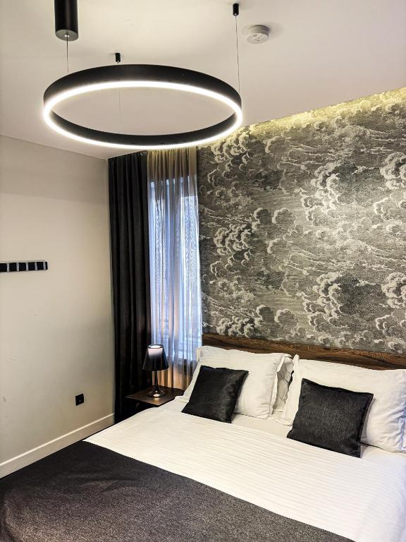 Postel nebo postele na pokoji v ubytování Calma Luxury Rooms