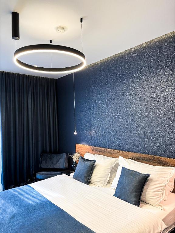 Postel nebo postele na pokoji v ubytování Calma Luxury Rooms