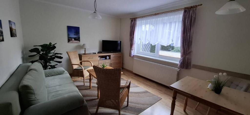 TV a/nebo společenská místnost v ubytování Ferienwohnung Haus Marianne