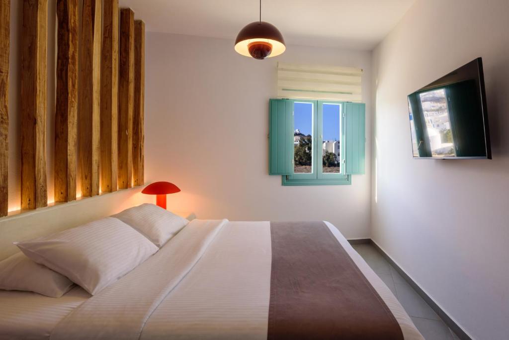Postel nebo postele na pokoji v ubytování Neptune Luxury Suites