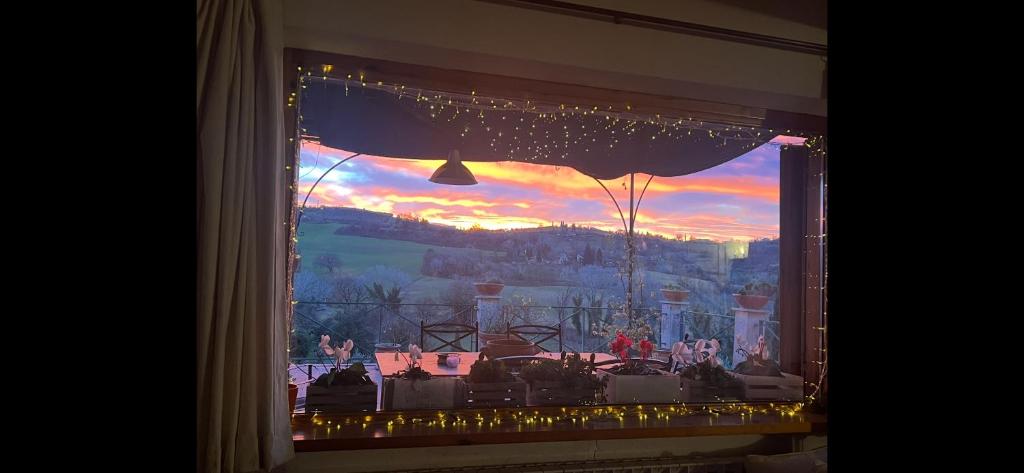 a window with a view of a stage with lights at Country house Il Poggio in Otricoli