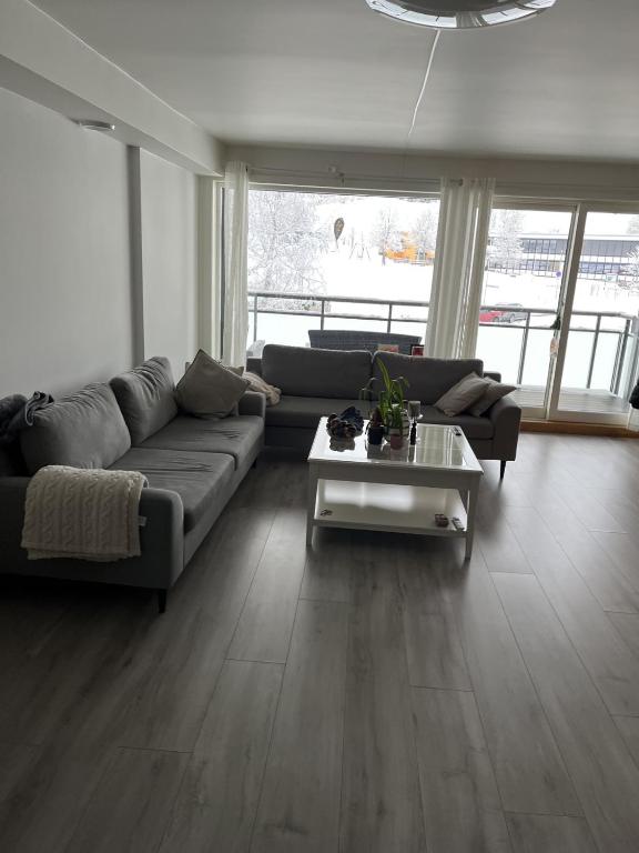 a living room with a couch and a coffee table at Trondheim in Trondheim