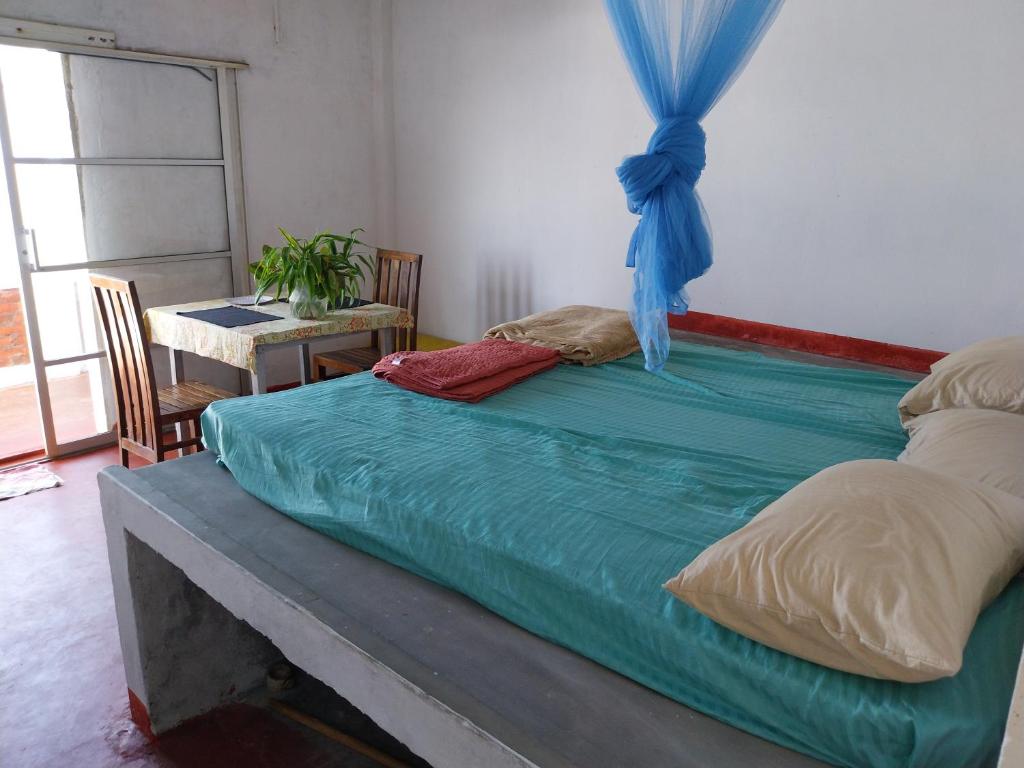 Postel nebo postele na pokoji v ubytování Inuli Coco Hut