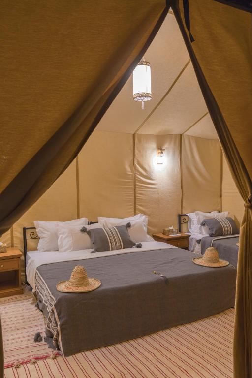Postel nebo postele na pokoji v ubytování Luxury Trippers Camp