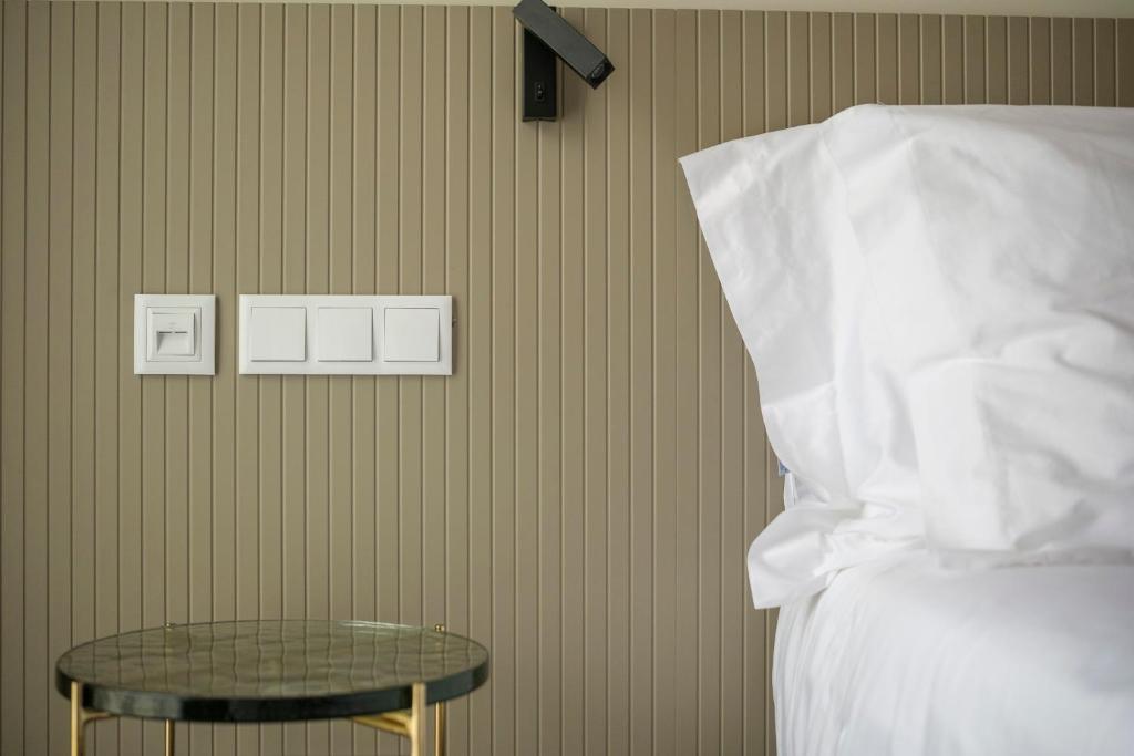 Postel nebo postele na pokoji v ubytování Azores Book Hotel