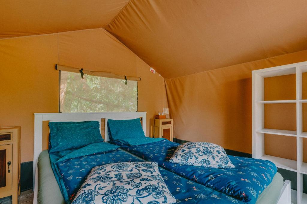 Postel nebo postele na pokoji v ubytování Rendes Glamping