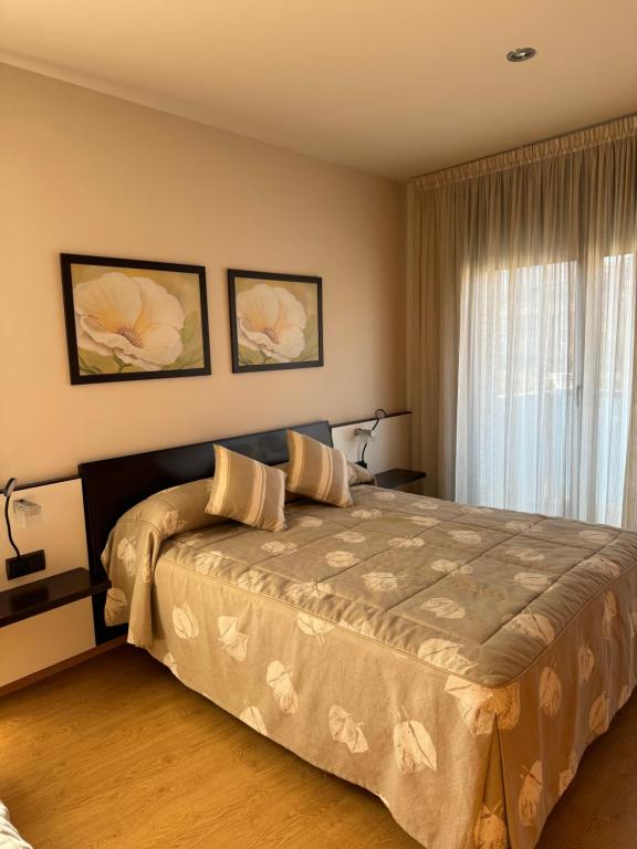 Postel nebo postele na pokoji v ubytování Apartamentos Turísticos Can Rocamora