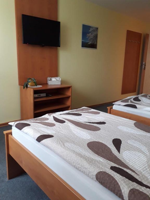 Postel nebo postele na pokoji v ubytování Pension Olga
