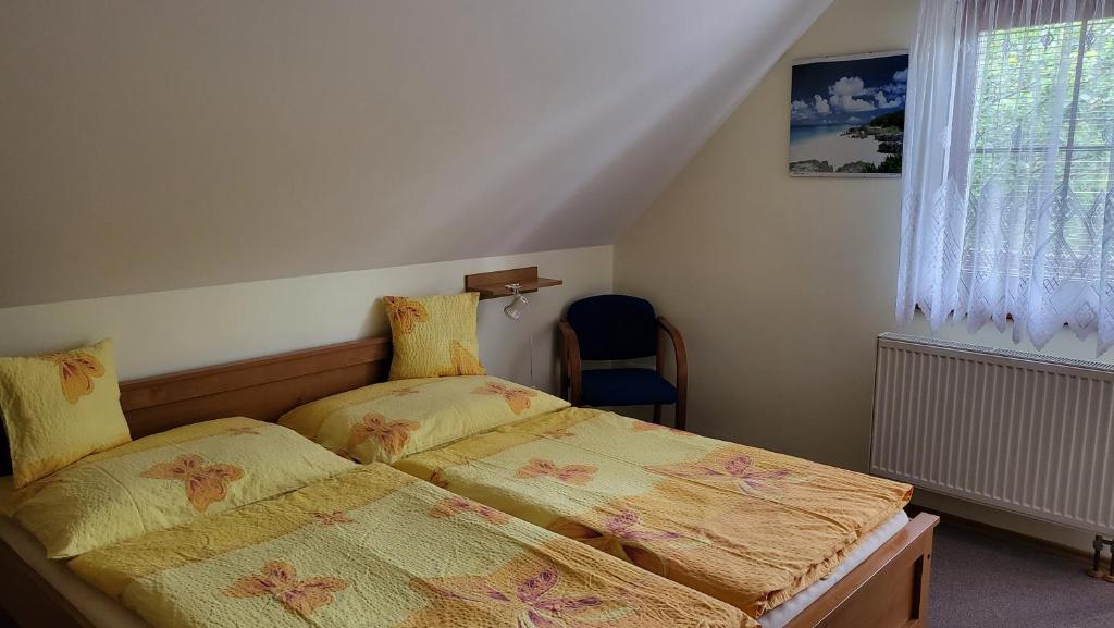 Postel nebo postele na pokoji v ubytování Pension Olga