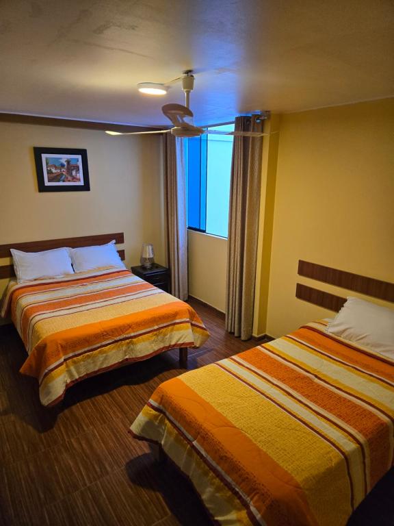 Postel nebo postele na pokoji v ubytování Nasca Travel One Hostel