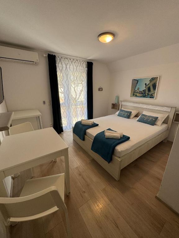 Postel nebo postele na pokoji v ubytování Guest House Kovacevic