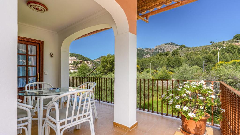 a patio with a table and chairs on a balcony at Apartment Sol 2 in Port de Soller