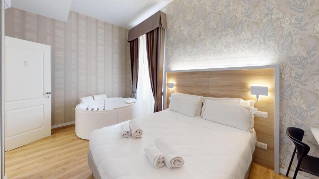 Postel nebo postele na pokoji v ubytování ROME'S GLORIA HOTEL