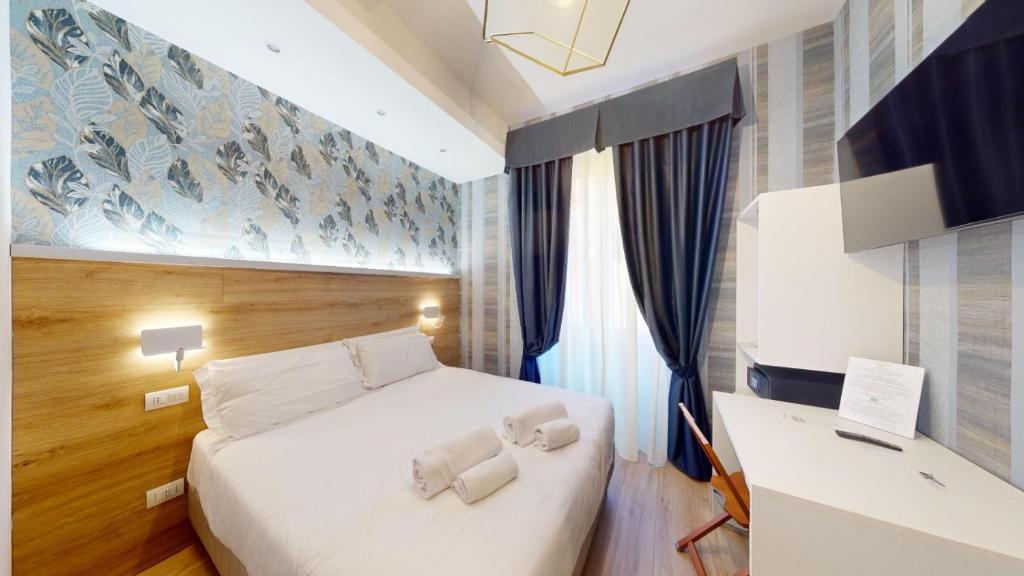 Postel nebo postele na pokoji v ubytování ROME'S GLORIA HOTEL