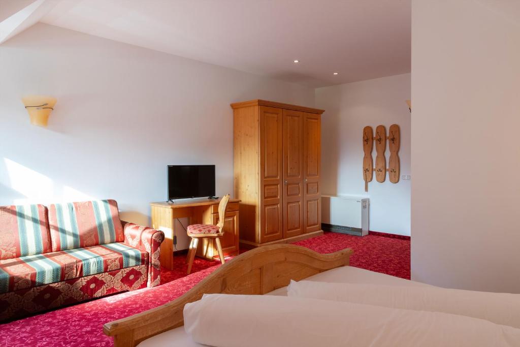 Postel nebo postele na pokoji v ubytování Hotel Sachsenklemme