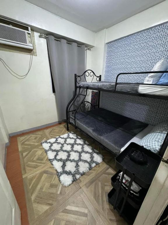 Ένα ή περισσότερα κρεβάτια σε δωμάτιο στο Gotstyle condos