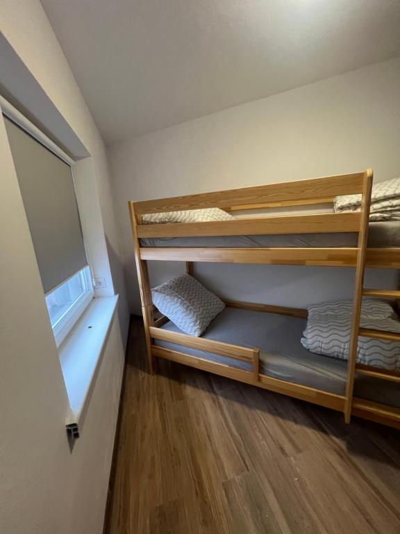 a small room with bunk beds in it at Bestdrive Pokój 1 in Babienica