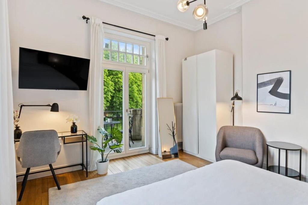 Letto o letti in una camera di Spacious & Tranquil Rooms in Limpertsberg