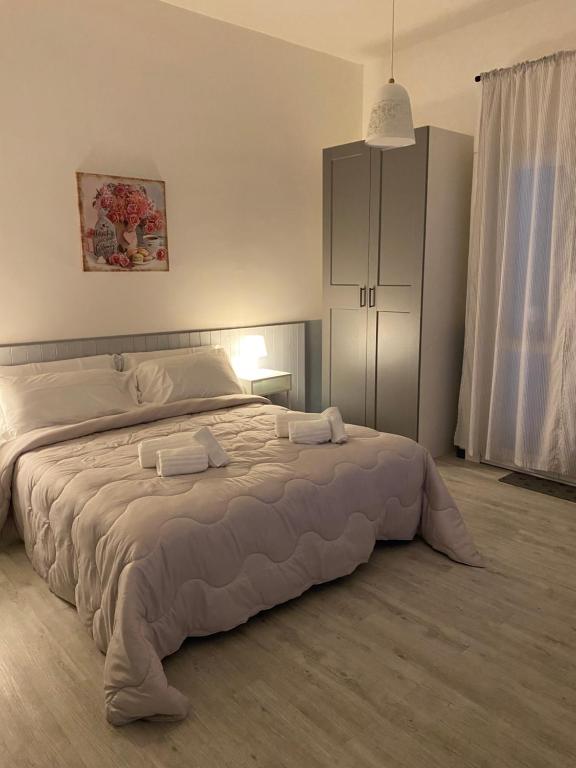 Postel nebo postele na pokoji v ubytování La casetta di Nina