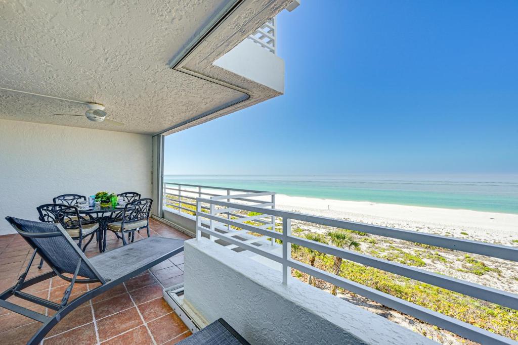 a dining room with a view of the beach at Oceanfront Marco Island Escape with Beach Access! in Marco Island