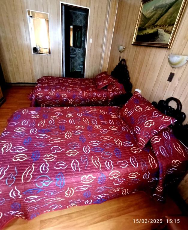 Postel nebo postele na pokoji v ubytování Hotel Di Maurier