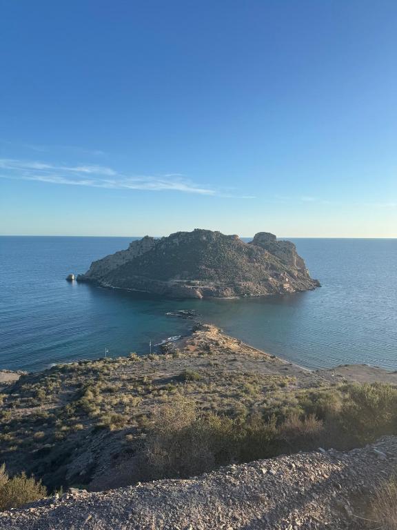 an island in the middle of a body of water at Apartmán se 2 ložnicemi in Isla del Fraile