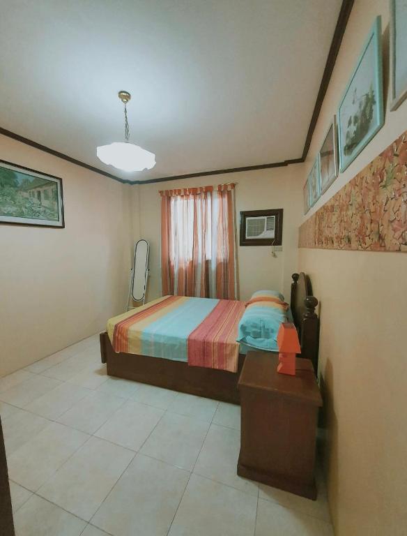 Voodi või voodid majutusasutuse The VillasCo Local Home at San Juan La Union toas