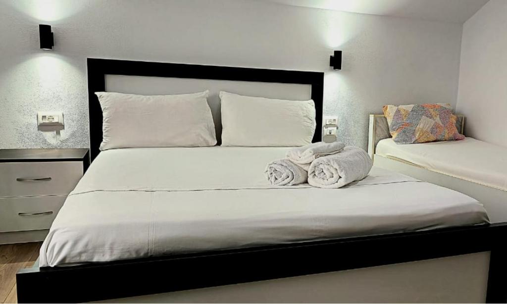 Postel nebo postele na pokoji v ubytování Guest House Pogradeci