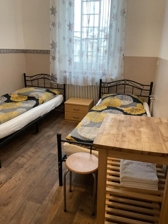 Postel nebo postele na pokoji v ubytování Pension&Hostel Anna - Monteurzimmer