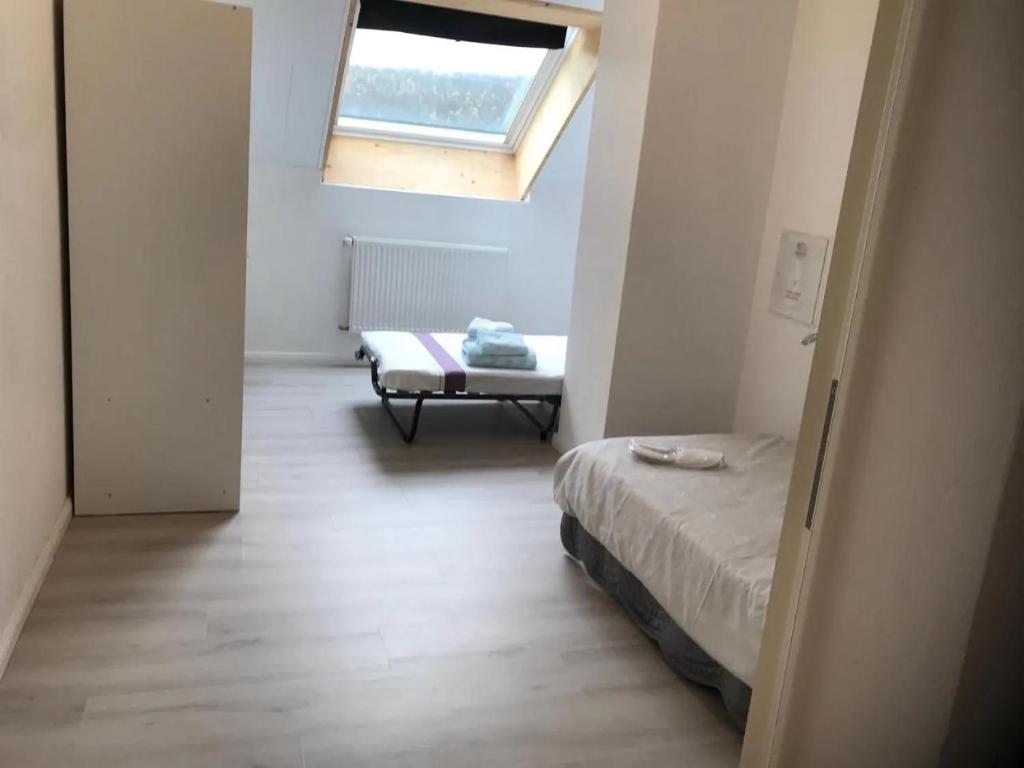 Postel nebo postele na pokoji v ubytování Osmose