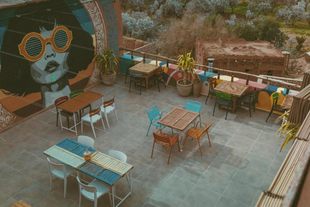 an overhead view of a patio with tables and chairs at taman'art space in Aït Benhaddou