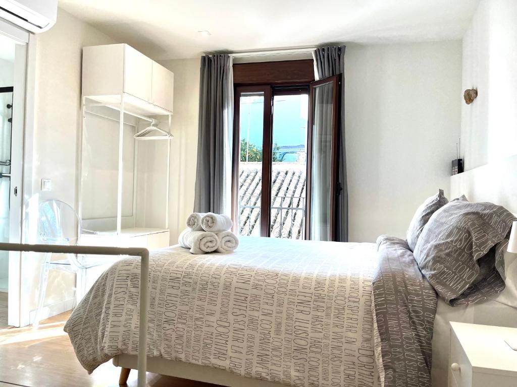 Postel nebo postele na pokoji v ubytování Casa Torre Hacho
