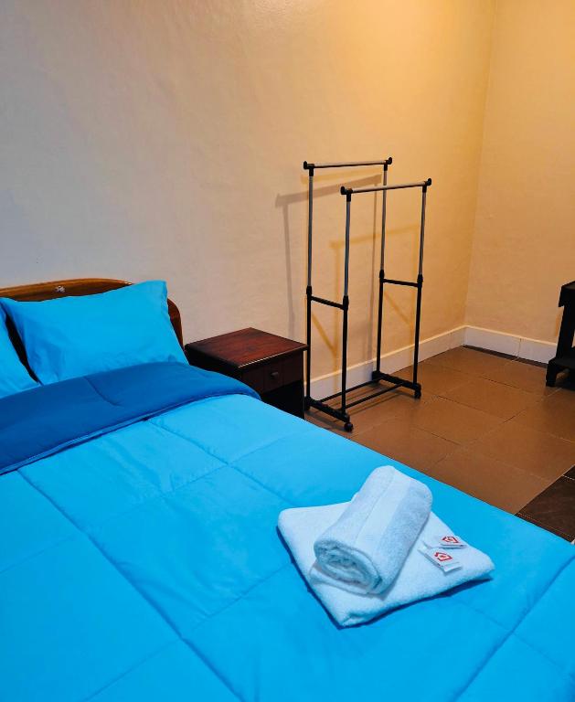 Postel nebo postele na pokoji v ubytování Travel Hotel Quito